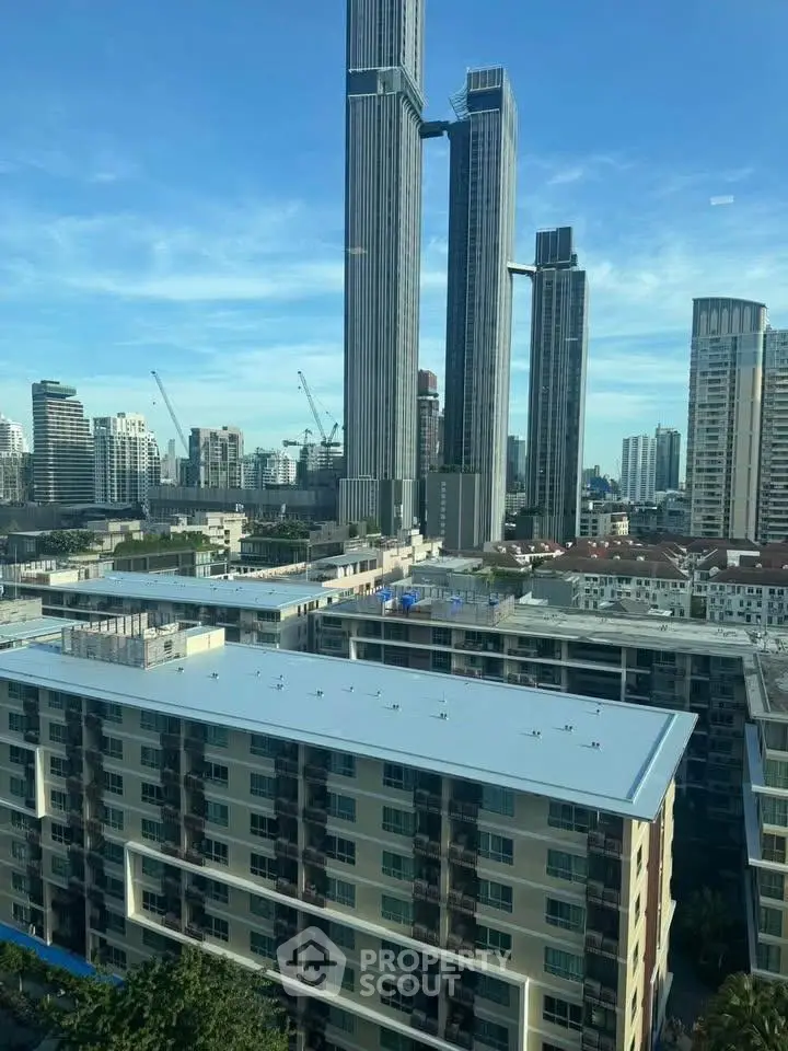 Stunning cityscape view with modern high-rise buildings and clear blue sky.