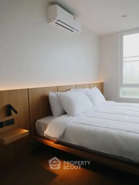 Modern bedroom with minimalist design and natural light