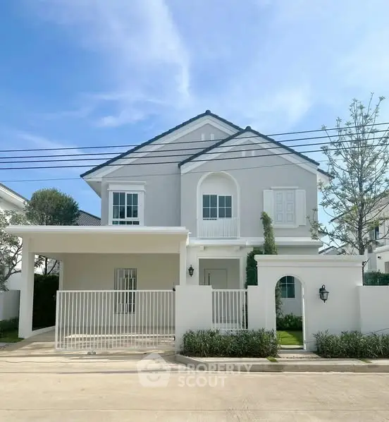 Elegant two-story house with modern facade and spacious driveway