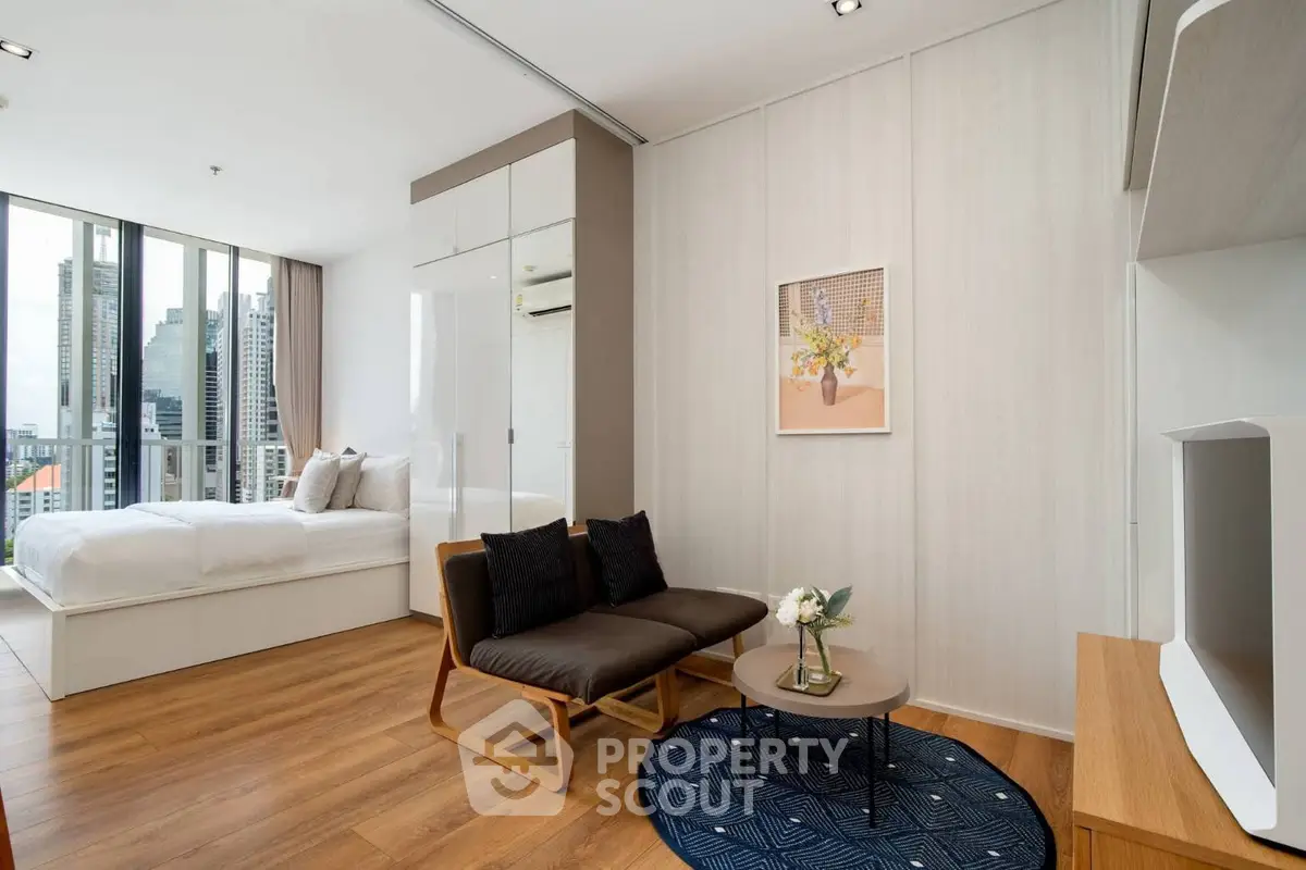 Modern studio apartment with stylish decor and city view