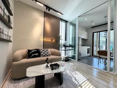 Modern living room with stylish decor and open kitchen layout