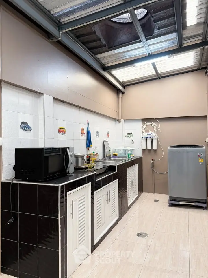 Spacious kitchen with modern appliances and ample counter space
