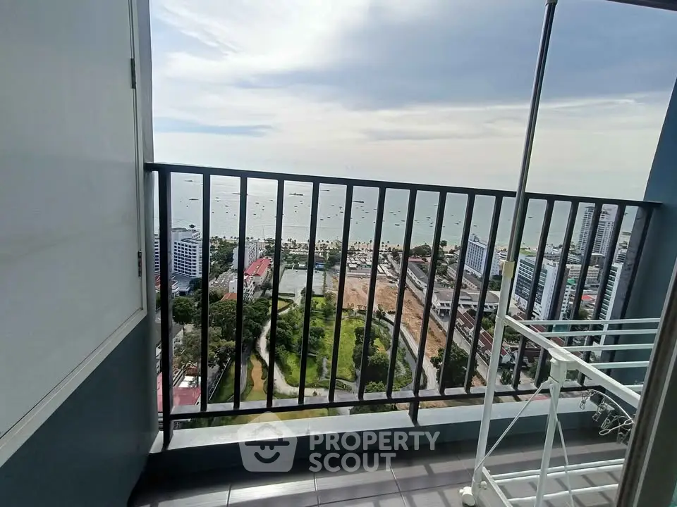 Stunning high-rise balcony view overlooking cityscape and ocean horizon
