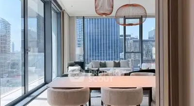 Modern living room with floor-to-ceiling windows and city view