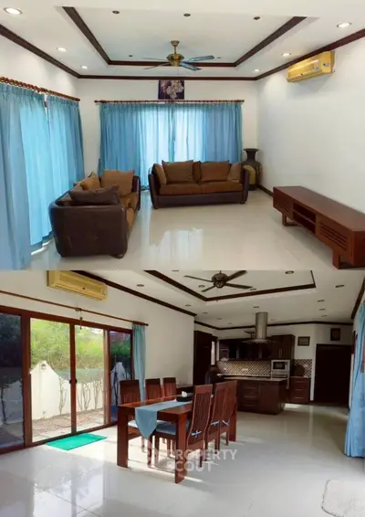 Spacious living and dining area with modern furnishings and large windows.