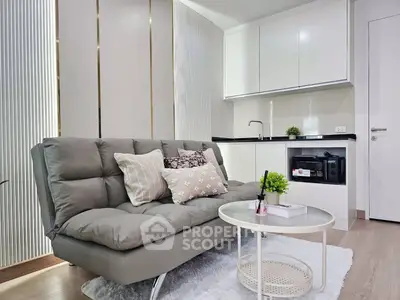 Modern living room with sleek kitchenette and stylish decor