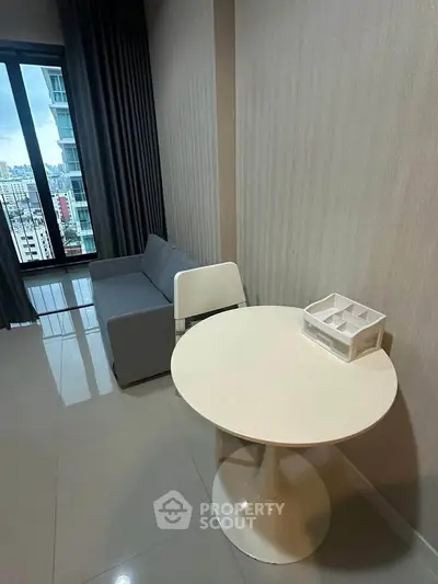 Modern living room with sleek furniture and city view, perfect for urban living.