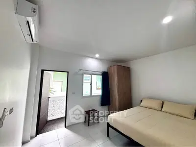 Modern bedroom with air conditioning and minimalist design