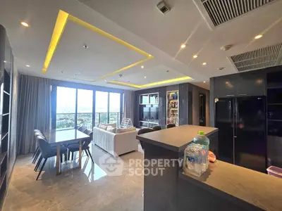 Luxurious open-plan living room with stunning city view and modern furnishings