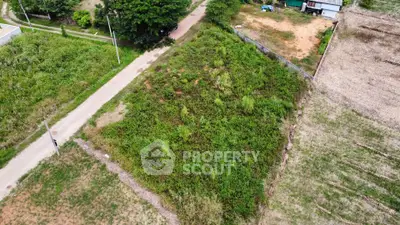 Prime land plot with lush greenery, ideal for development in a serene location.