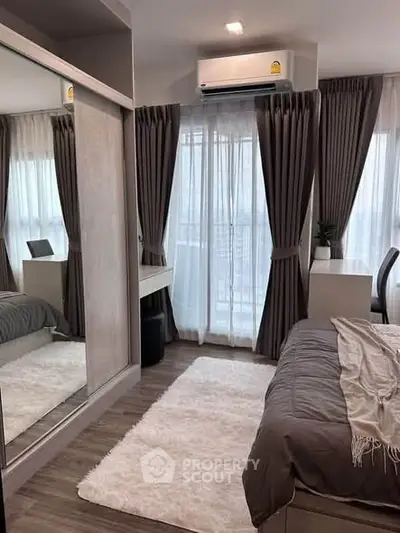 Modern bedroom with large window, stylish curtains, and cozy decor in a contemporary apartment.