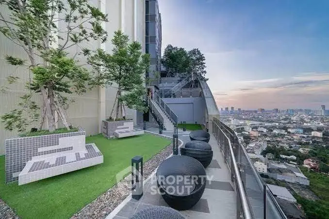 Stunning rooftop garden with panoramic city views and modern seating area.