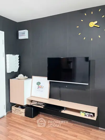 Modern living room with wall-mounted TV and stylish decor