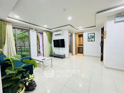 Spacious modern living room with large windows and stylish decor