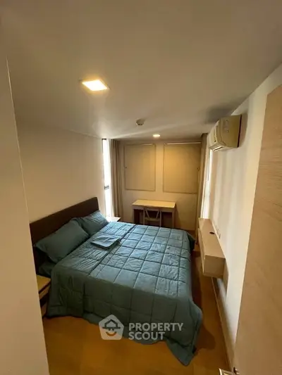 Cozy bedroom with modern furnishings and natural light, perfect for restful nights.
