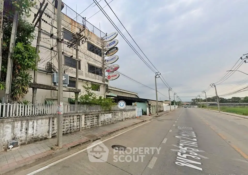Commercial building exterior with signage on a quiet street