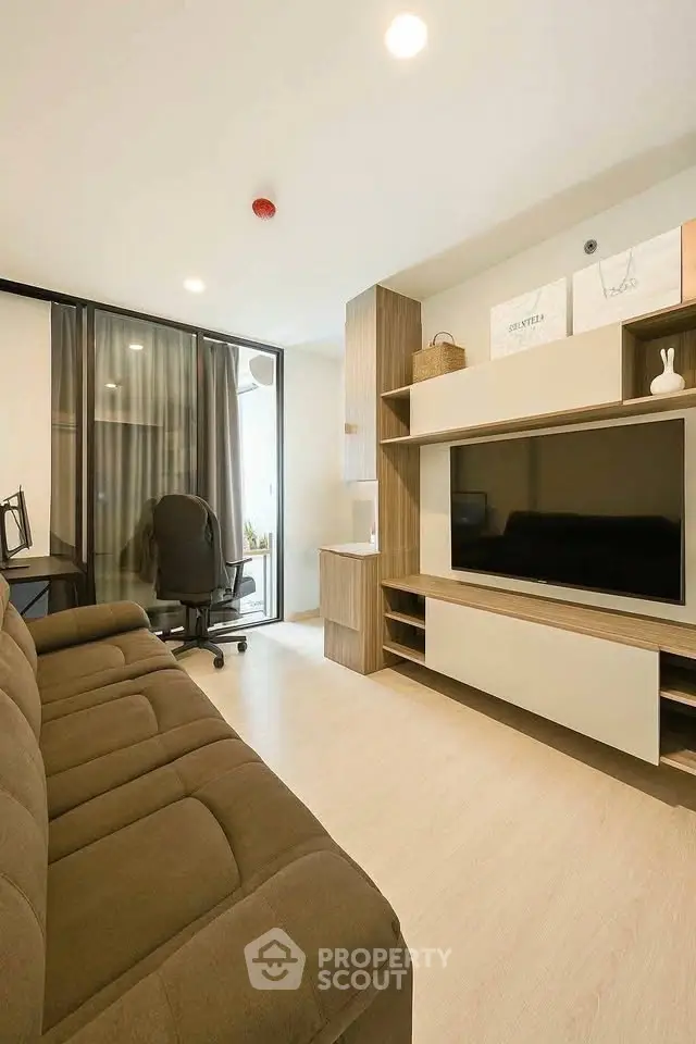 Modern living room with sleek furniture and natural light, perfect for urban living.