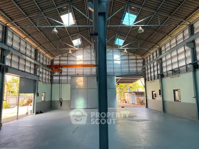 Spacious industrial warehouse with high ceilings and ample natural light