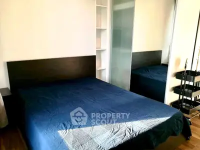 Cozy bedroom with modern design and ample natural light