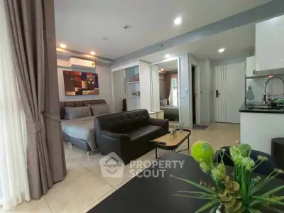 Modern open-plan living room with sleek kitchen and stylish decor