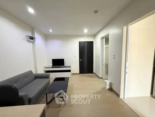 Modern living room with sleek furniture and neutral tones