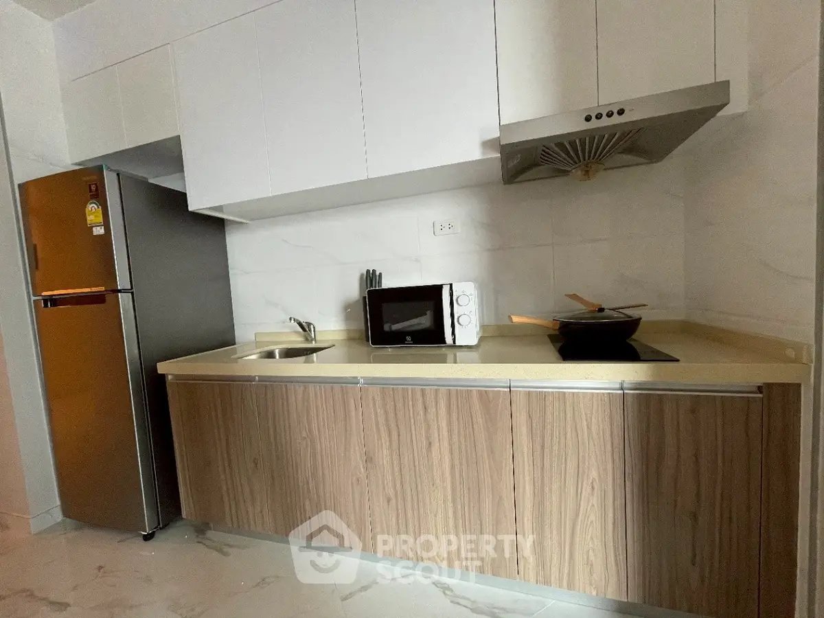 Modern kitchen with sleek cabinetry and stainless steel appliances