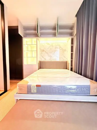 Modern bedroom with built-in shelves and stylish marble accent wall