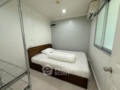 Cozy bedroom with modern air conditioning and minimalist design, perfect for restful nights.