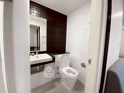 Modern bathroom with sleek design and contemporary fixtures in a stylish apartment.