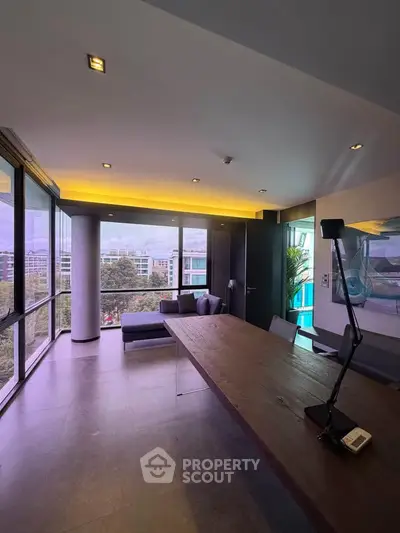 Modern living room with panoramic windows and stylish decor in urban apartment