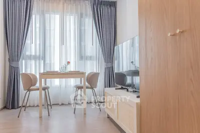 Modern living room with elegant dining set and large window with curtains