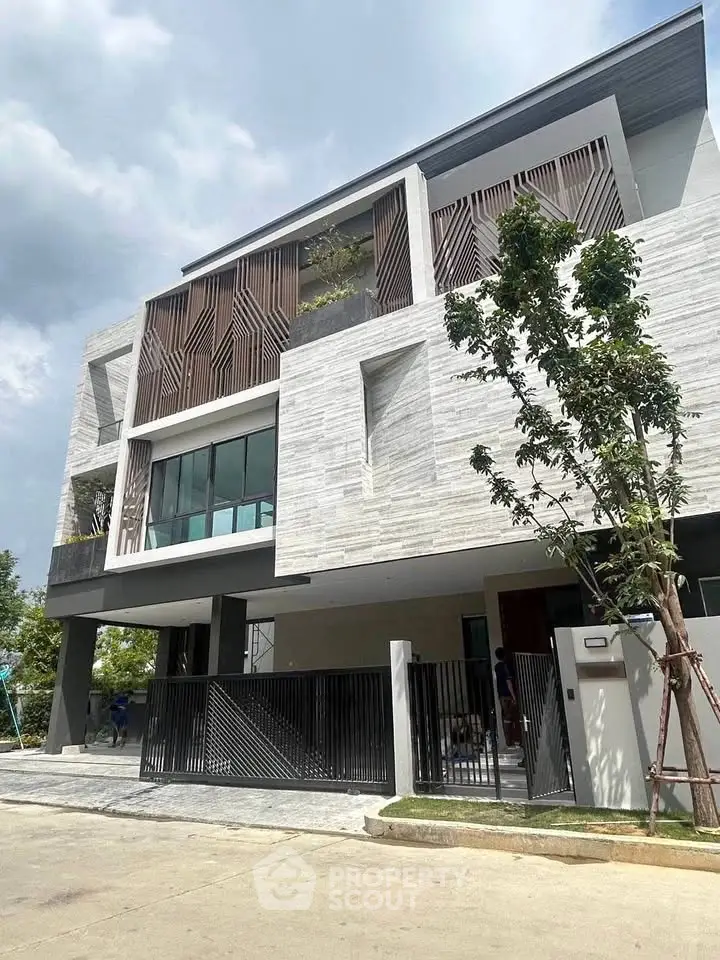 Modern architectural masterpiece with unique facade and spacious design in a serene neighborhood.