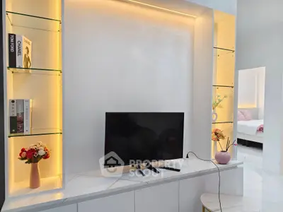 Modern living room with sleek TV setup and elegant shelving