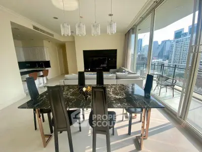 Luxurious open-plan living room with elegant dining area and stunning city view balcony.