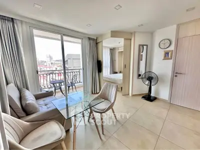 Modern apartment with open living room and balcony view