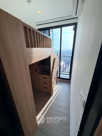 Modern compact bedroom with loft bed and balcony view