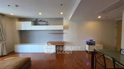 Spacious living room with modern built-in storage and hardwood floors