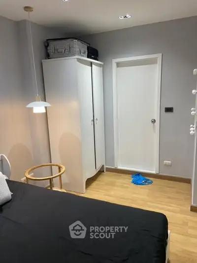 Cozy bedroom with modern decor and ample storage space