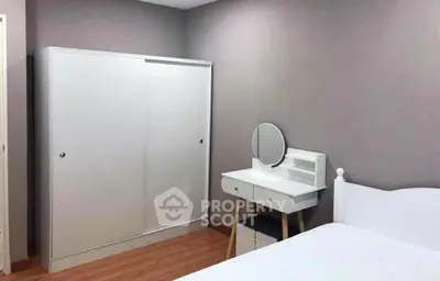 Modern bedroom with sleek wardrobe and stylish vanity set