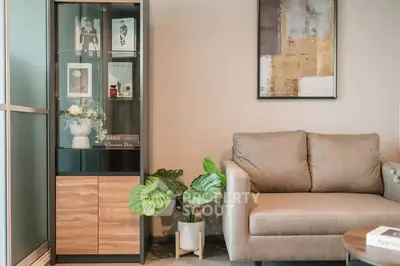 Stylish living room with modern sofa and elegant display cabinet