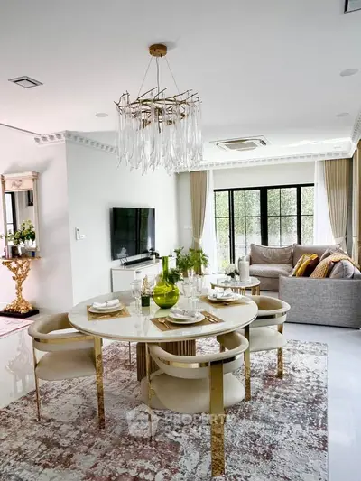 Luxurious living room with elegant dining area and modern decor