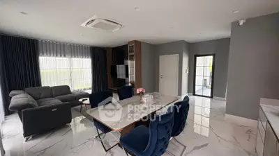 Luxurious modern living room with elegant dining area and stylish furniture