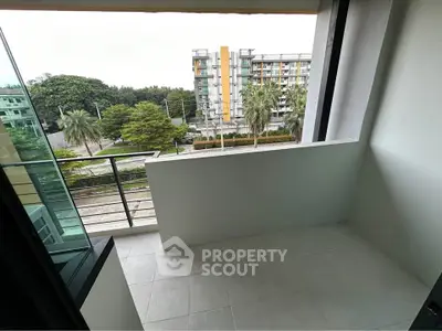 Modern balcony with city view, perfect for relaxation and enjoying the urban landscape.