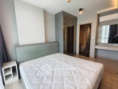 Modern bedroom with large mirror wardrobe and minimalist design