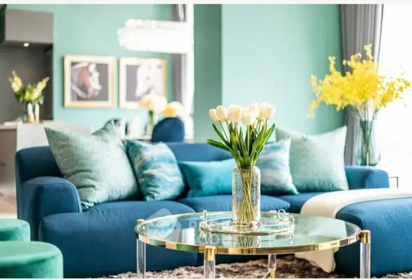 Luxurious living room with elegant blue sofa and chic decor