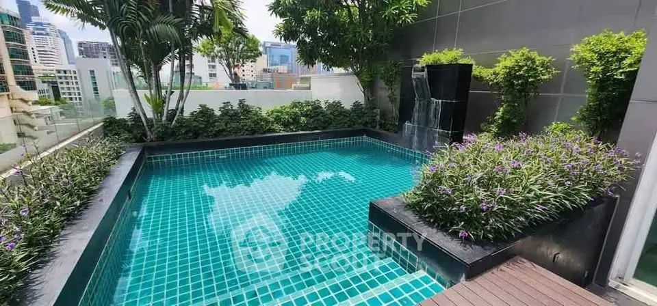 Luxurious rooftop pool with lush greenery and city views, perfect for relaxation and entertainment.