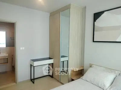 Modern bedroom with ensuite bathroom and stylish decor