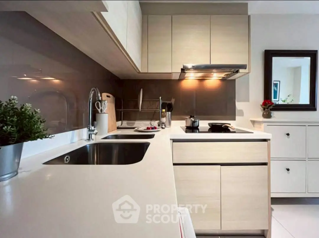 Modern kitchen with sleek cabinetry and stainless steel sink