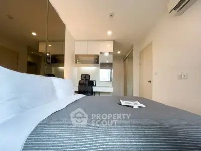 Modern bedroom with stylish decor and built-in study area, perfect for urban living.