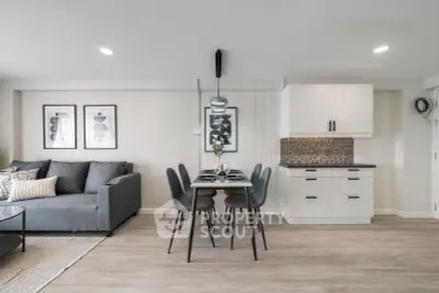 Modern living room with sleek dining area and stylish decor